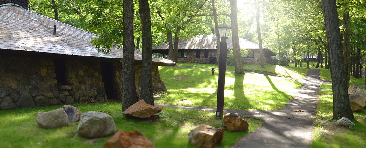 Stone Cottages along a path through the woods