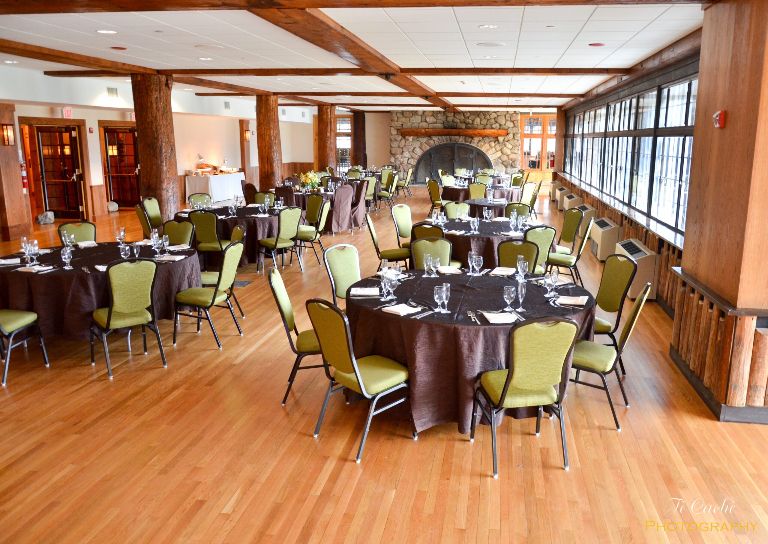 Large dinning area with a stone hearth in the background